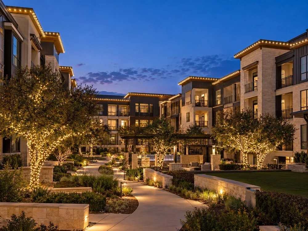 Design inspiration: multi-family grounds with warm white Christmas lighting