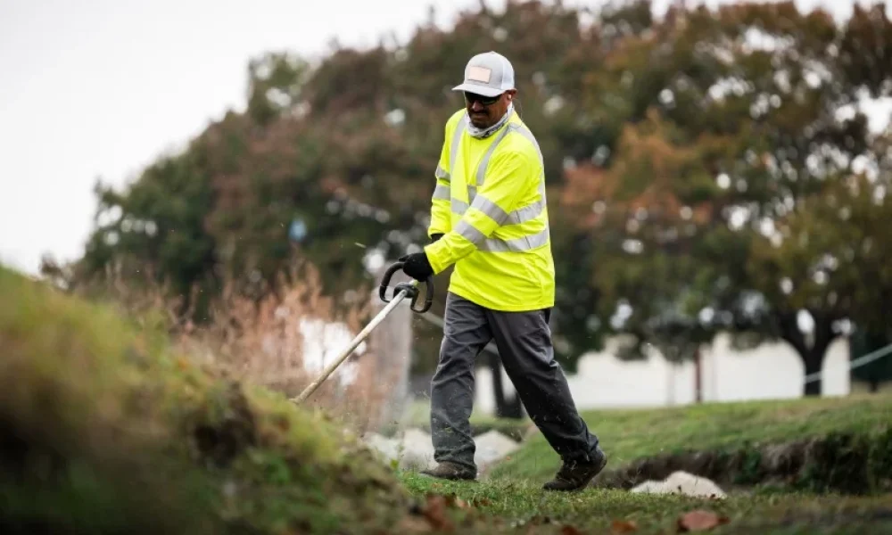 Black Hill Landscaping crew performing commercial lawn maintenance in Fort Worth