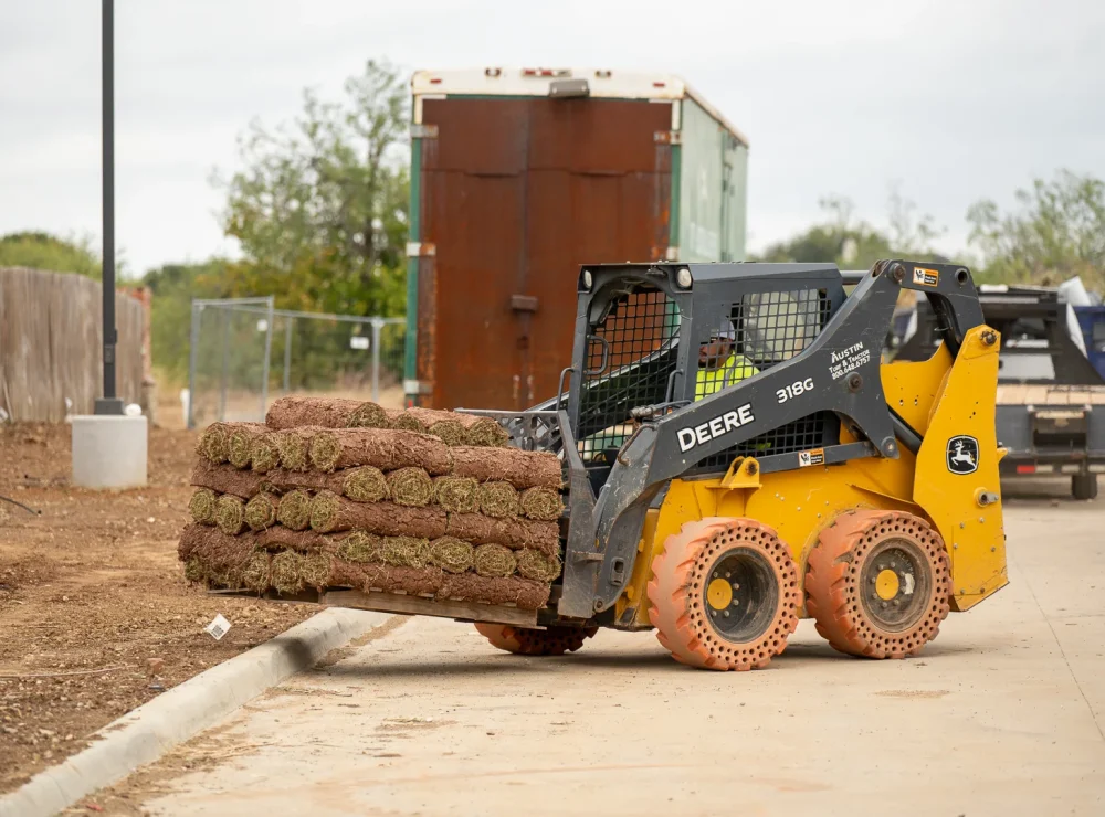 Soil preparation and grading for sod installation in Fort Worth